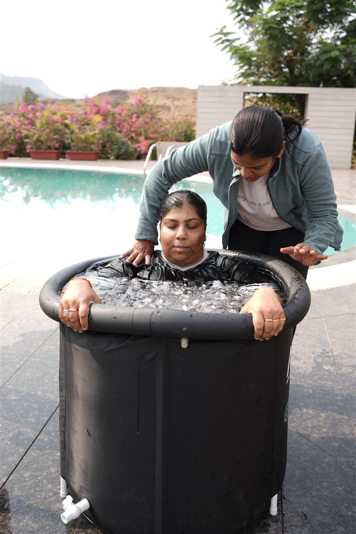 Rupali leading a calm breathing moment during an ice bath